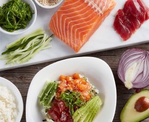 Fresh sushi, seaweed salad, rice, avocado and onion