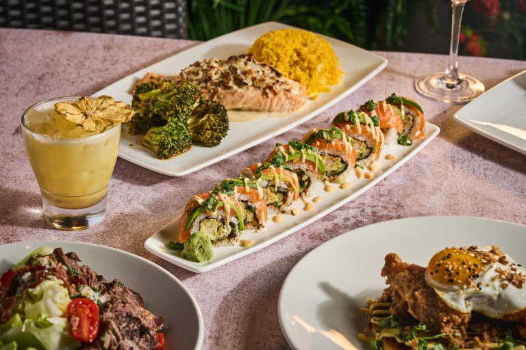 Kona grill specialty cocktail, sushi and some other delicious plates.