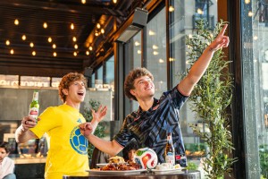 Two men celebrating World Cup at Kona Grill